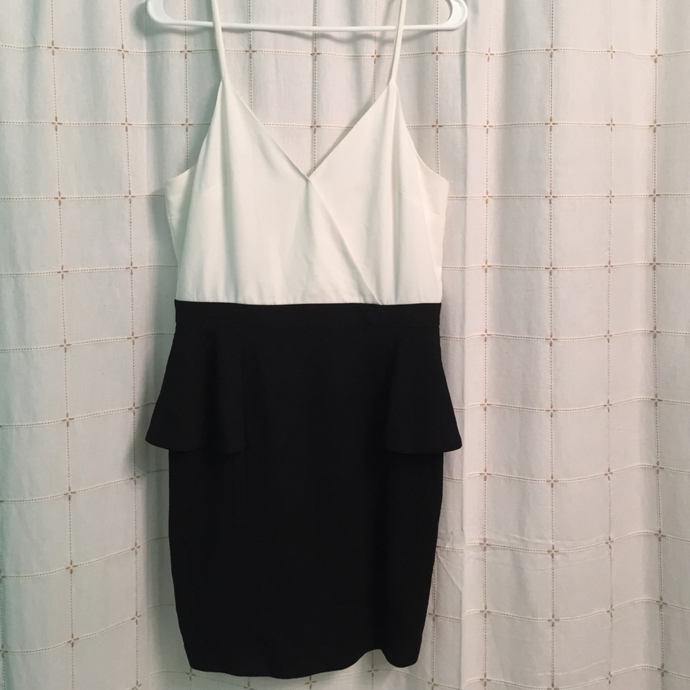Cute black & white dress. Only worn once. Has snap